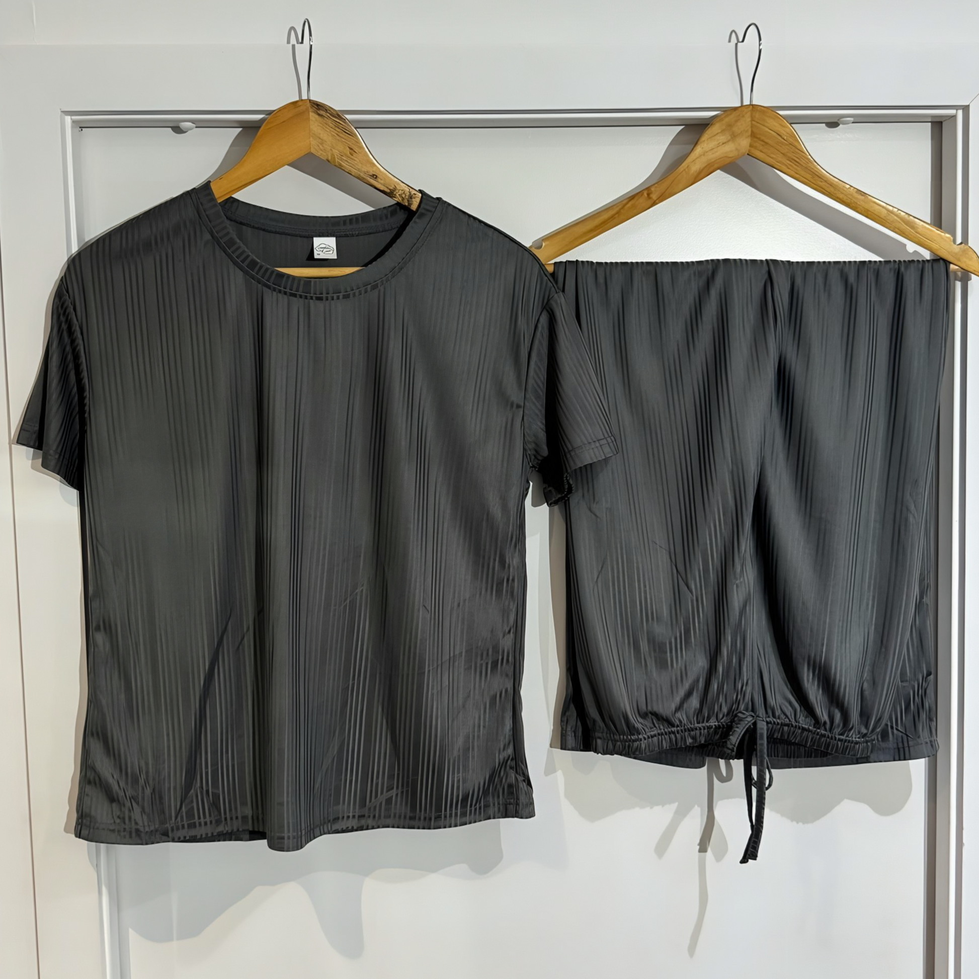 Serene Night pajama top and pants hanging side by side – minimalist and elegant design.