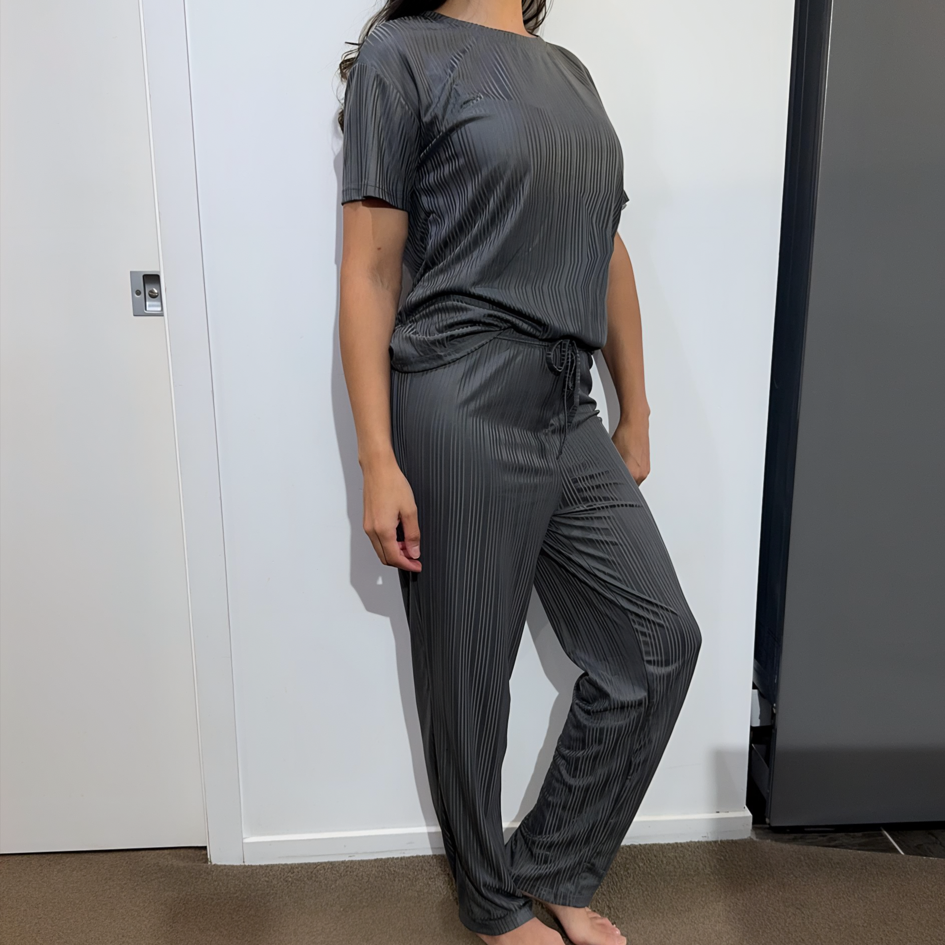 Front view of model wearing the Serene Night sleepwear set – comfortable fit in a sleek dark grey tone.